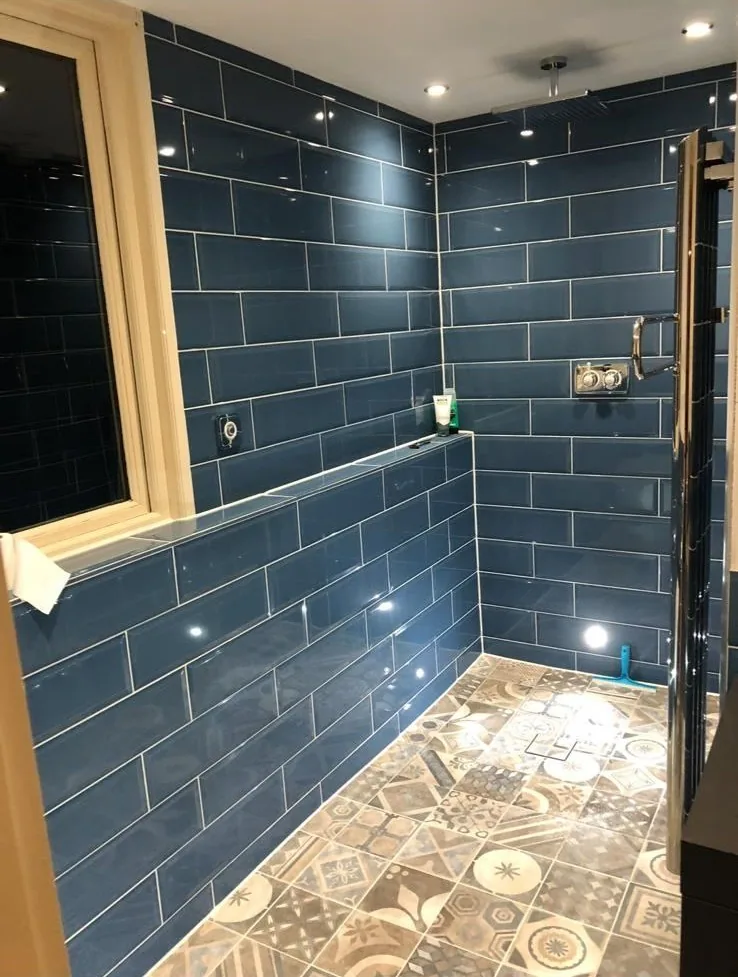 Shower enclosure with statement navy metro tiling